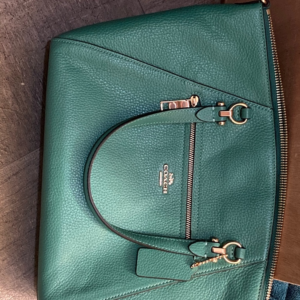 Coach purse. Never carried. Still has paper wrapping on the zipper.